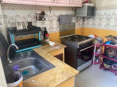 a kitchen with a sink and a stove at Comfort and Convenience in Casablanca