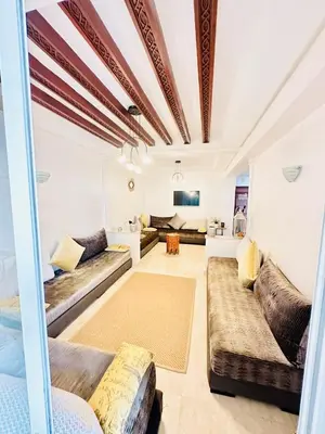a large living room with couches and a couch at Loft12 in Rabat