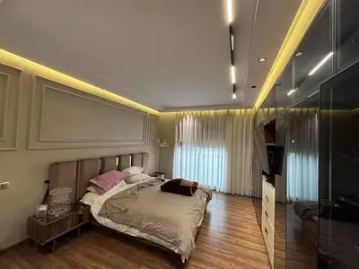 a bedroom with a large bed in a room at Escape for the whole family in Casablanca
