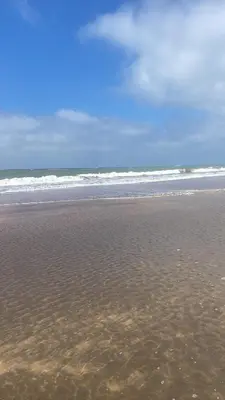 a sandy beach with the ocean in the background at Heaven Beach Sidi Rahal in Sidi Rahal