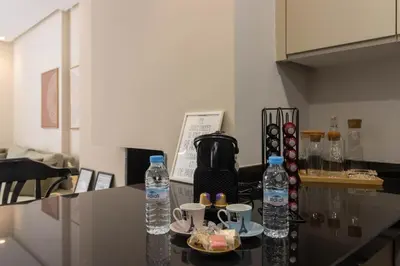 a counter with two bottles of water and a plate of food at BRYJ 34 Luxury studio les princesses maarif in Casablanca