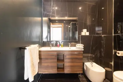 a bathroom with a sink and a toilet and a tub at BRYJ 34 Luxury studio les princesses maarif in Casablanca