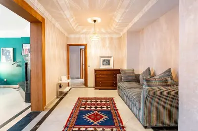a living room with a couch and a rug at Chic appartement in Casablanca in Casablanca