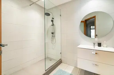 a bathroom with a shower and a sink and a mirror at Chic appartement in Casablanca in Casablanca