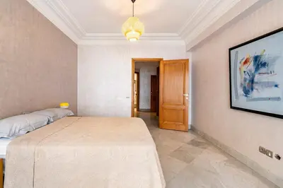 a room with a bed and a picture on the wall at Chic appartement in Casablanca in Casablanca