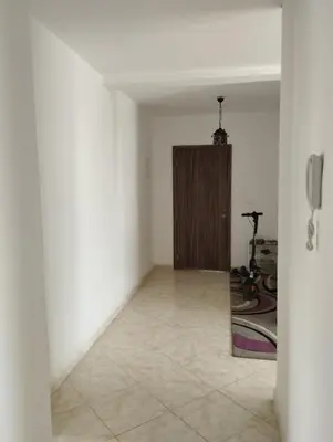 a hallway with a door in a room at Khalid in Bouznika