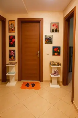 a bathroom with a door and a rug on the floor at Résidence calme 3 chambres pour votre hébergement in Bouznika