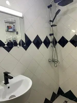 a bathroom with a sink and a shower at Studio Corniche Casablanca in Casablanca
