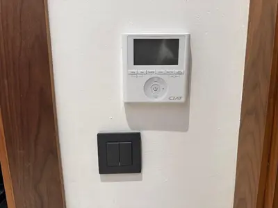 a computer on a wall with a box on it at Modern Studio Princesses District in Maarif
