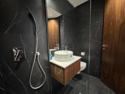 a bathroom with a toilet and a sink and a shower at Modern Studio Princesses District in Maarif