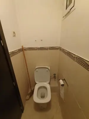 a small bathroom with a toilet and a roll of toilet paper at SUMMER AND FAMILY APPARTEMMENT ,mouhamadia in Mohammedia