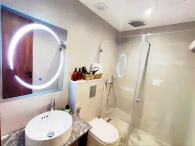 a bathroom with a toilet and a sink and a shower at Studio Confortable et Cozy 5 min du stade CAN2025- Maarif Casablanca in Casablanca
