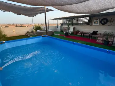 a large blue swimming pool on the roof of a house at 322 Costa beach , Bouznika in Bouznika