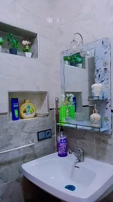 a bathroom with a sink and a mirror at Hatime zarkaoui in Casablanca