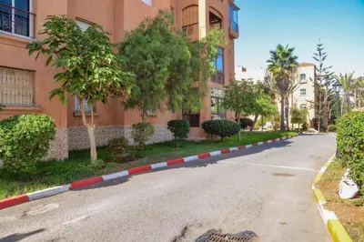 an empty street in front of a building at Appartement a louer a mansouria rico flores in O Ben Slimane