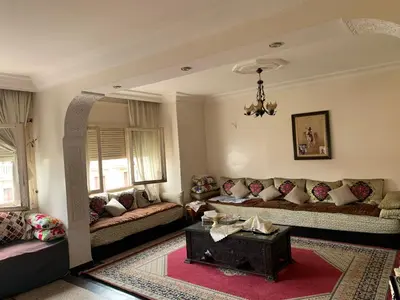a living room with couches and a table at Résidence sara in Casablanca