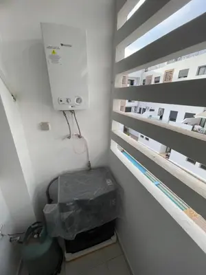 a small room with a unit on the side of a building at Luxueux appartement a harhoura près de la mer in Temara