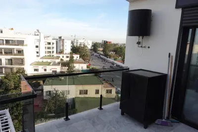 a balcony with a view of a city at Calm and lovely appartement well located in Casablanca