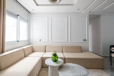 a living room with a couch and a table at TT Holidays Centro in Rabat