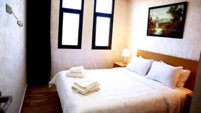 a bedroom with a bed with two towels on it at Beautiful and cosy apartment in Casablanca