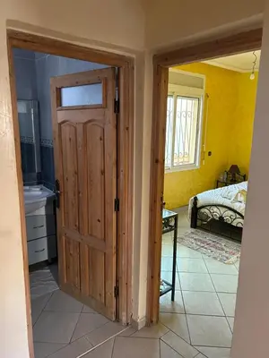 an open door in a room with a bedroom at Villa Chérine in Casablanca