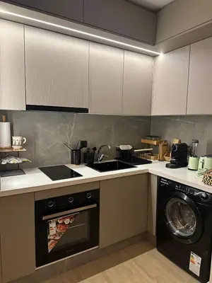 a kitchen with a washing machine and a washer at Hidden Central Cozy Gem Ghandi Calm Fast WiFi Parking in Casablanca