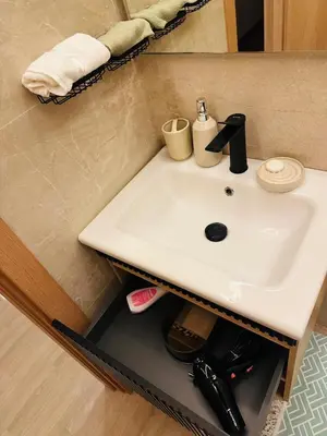 a white sink in a bathroom with a mirror at Hidden Central Cozy Gem Ghandi Calm Fast WiFi Parking in Casablanca