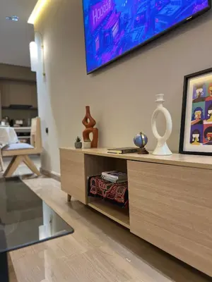 a living room with a tv on the wall at Hidden Central Cozy Gem Ghandi Calm Fast WiFi Parking in Casablanca