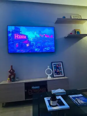 a living room with a flat screen tv on the wall at Hidden Central Cozy Gem Ghandi Calm Fast WiFi Parking in Casablanca