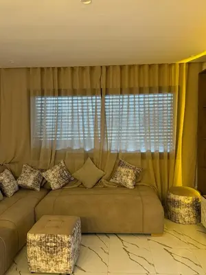 a couch sitting in front of a large window at Superbe Modern Studio Casa City Center in Casablanca