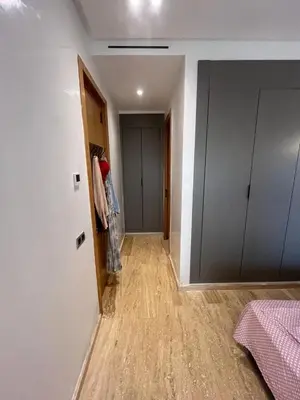 a room with a hallway with a closet and a door at Relaxing Apartment Oceanic Sidi Rahal in Sidi Rahal