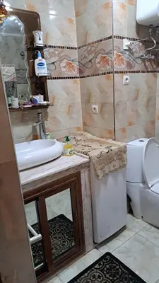 a bathroom with a sink and a toilet at Lux apartment Maarif in Maarif