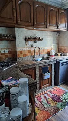 a kitchen with a sink and a counter top at Lux apartment Maarif in Maarif