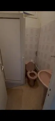 a bathroom with a toilet and a sink at Petit Nid Casablanca in Casablanca