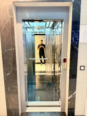 a man standing in an elevator in a building at Cosy Modern Retreat in Casablanca in Casablanca