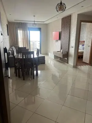 a living room with a table and a couch at Casablanca luxury Studio in Casablanca