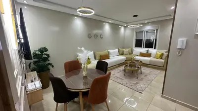 a living room with a couch and a table at cozy appartement in Casablanca
