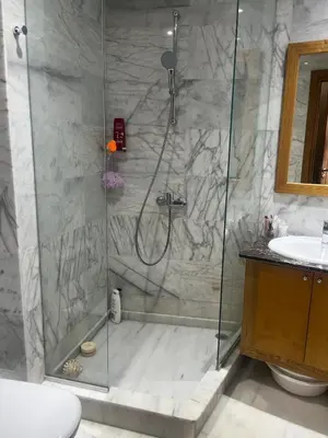 a bathroom with a shower and a sink at Evazion in O Ben Slimane