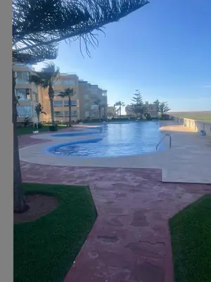 a view of a swimming pool in a resort at Evazion in O Ben Slimane