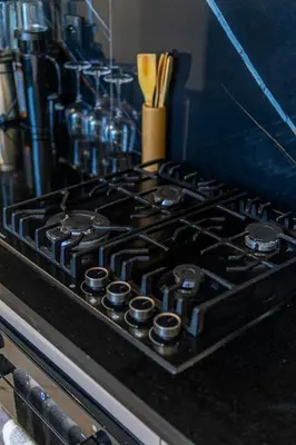 a stove top with a bunch of burners on it at maarif Centre elegant et comfortable duplex in Casablanca