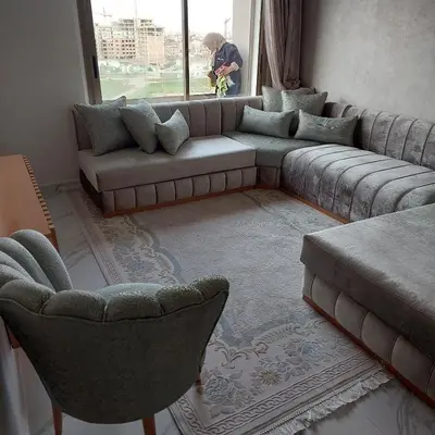 a living room with a couch and chairs and a window at appartement à Zenata casablanca in Aïn Harrouda