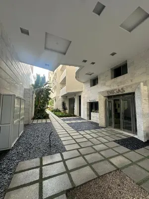 an empty walkway in front of a building at Modern Cozy Apartment Near beach in Casablanca