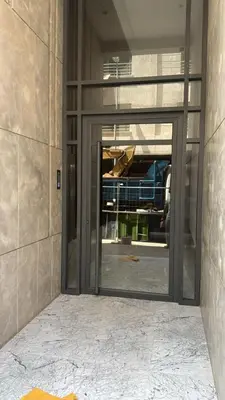 an entrance to a building with a glass door at Chic Studio Near Beach & Cafés in Casablanca