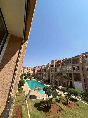 a view of a swimming pool from a building at Ricoflores Palm in O Ben Slimane