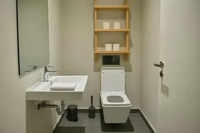 a bathroom with a sink and a toilet and a mirror at Lux apartment, wifi, Netflix, parking in Casablanca
