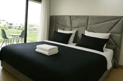 a bedroom with a large bed with two towels on it at Lux apartment, wifi, Netflix, parking in Casablanca