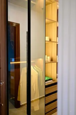 a glass closet with a table in it at The 5-Suite Beachfront Villa in O Ben Slimane
