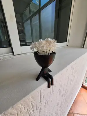 a flower pot sitting on the ledge of a porch at Ideal apartment for business trips in Casablanca