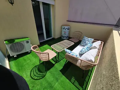 a room with a balcony with a table and chairs at Ideal apartment for business trips in Casablanca