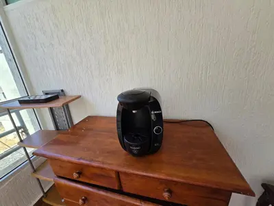 a black appliance sitting on top of a wooden table at Ideal apartment for business trips in Casablanca